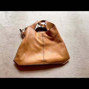 Vince Camuto camel colored leather hobo bag.